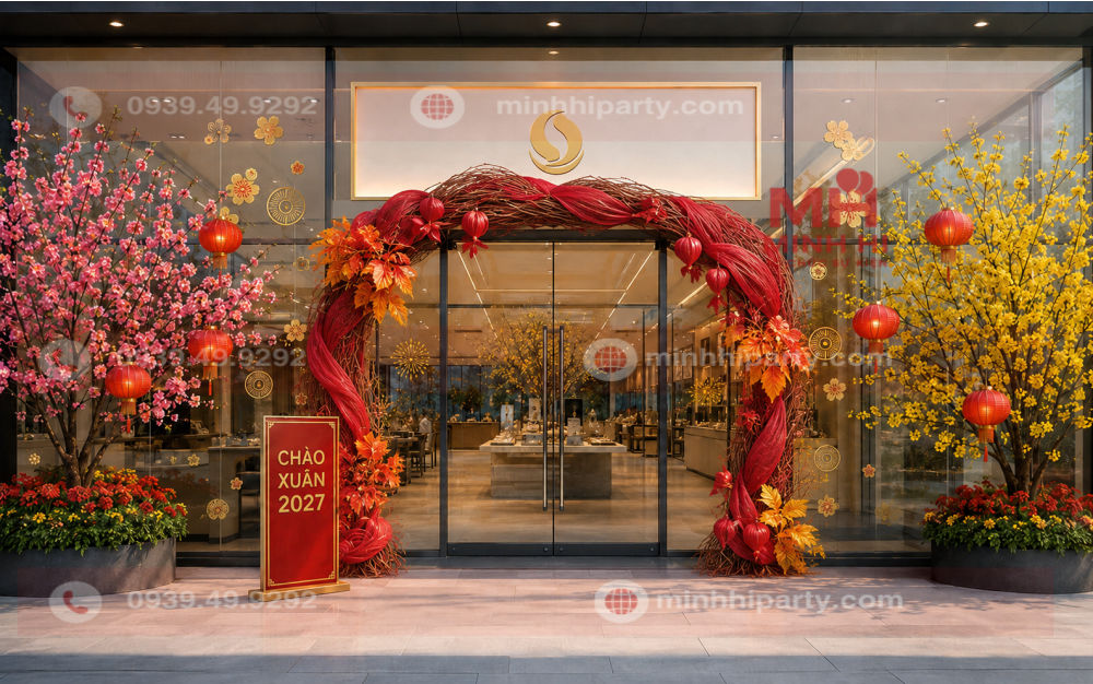 trang tri cong chao tet 2027 cho showroom Trang trí Tết 2027 cho showroom bằng cổng cành khô, lá nhuộm thủ công, cây đào và cây mai thật.