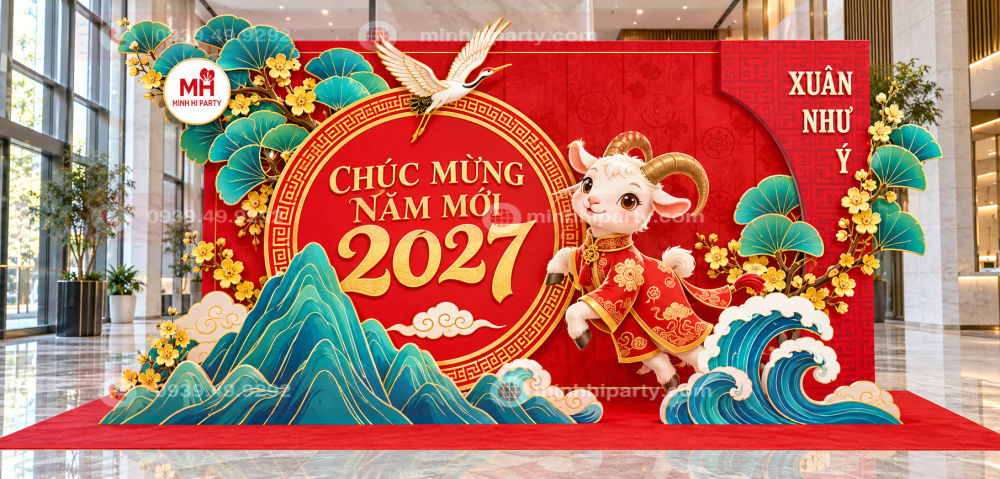 Backdrop trang trí Tết 2027 phối đỏ và xanh theo màu thương hiệu, kết hợp dê cách điệu