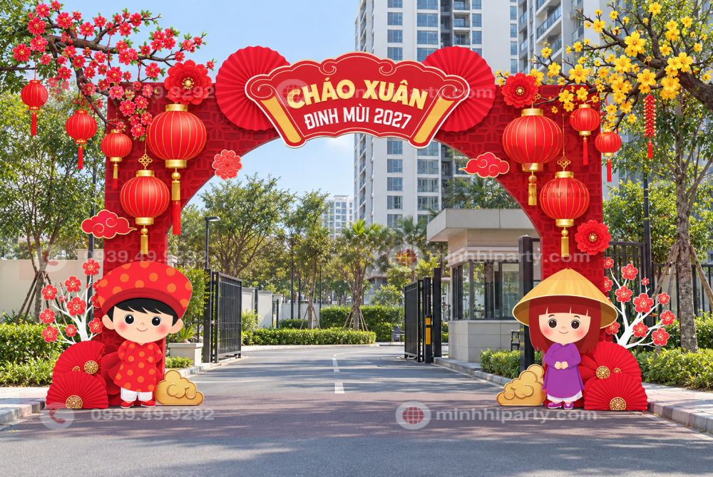 Trang trí Tết khu dân cư với cổng chào Xuân Đinh Mùi 2027 đặt trực tiếp trên mặt đường trước lối ra vào.
